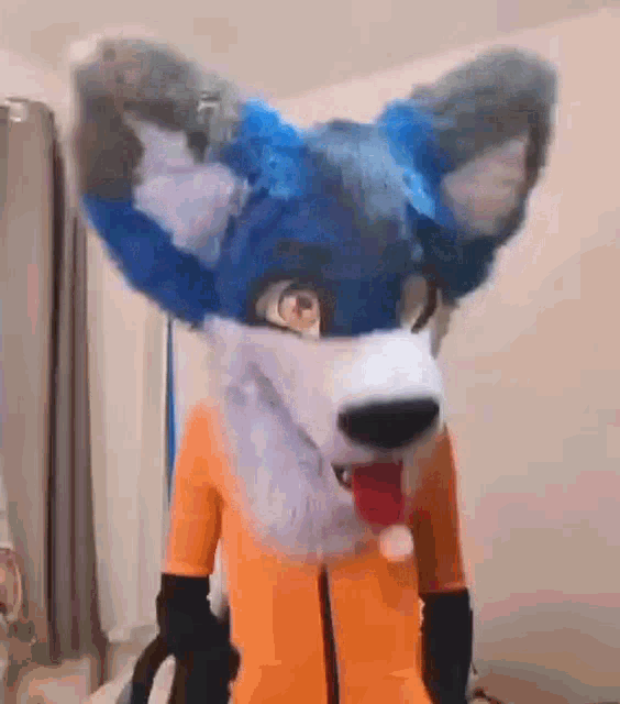 a person in a furry fox costume is standing in a living room .