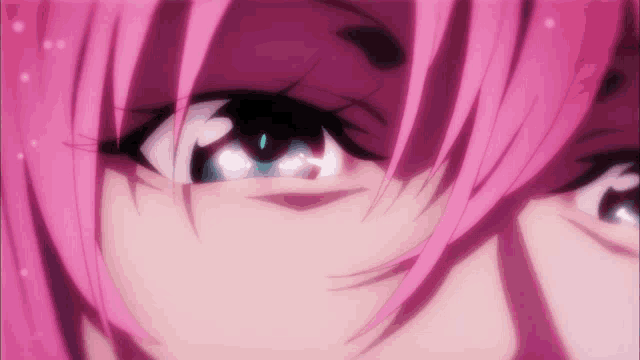a close up of a person 's eye with pink hair