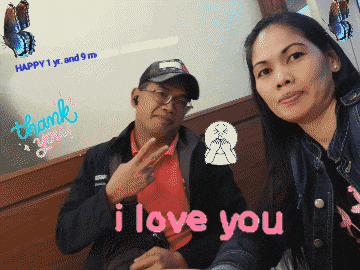 a man and a woman are posing for a picture with the words i love you in the foreground
