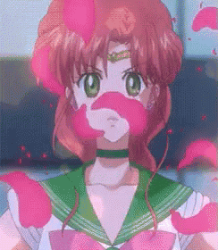 a girl with red hair and green eyes is wearing a sailor suit and has pink petals coming out of her mouth .