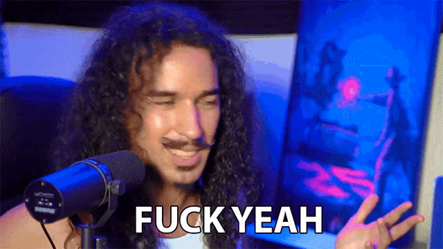 a man with long curly hair says fuck yeah