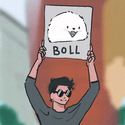 a man holding up a sign that says boll