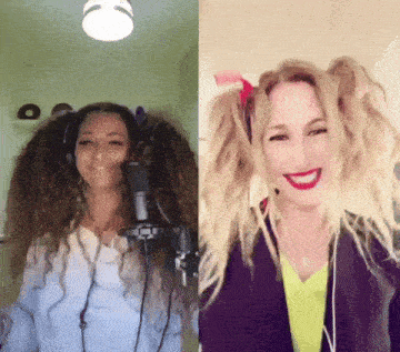 a woman wearing headphones stands in front of a microphone next to another woman with pigtails