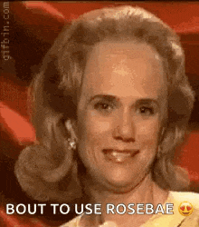 a close up of a woman 's face with the words `` bout to use rosebae '' written on the bottom .
