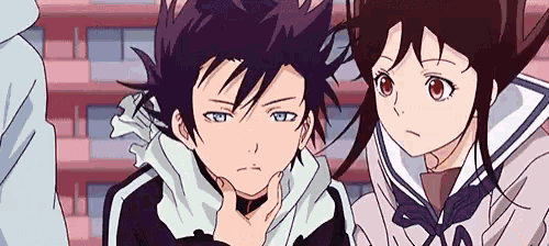 a boy and a girl are standing next to each other .