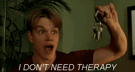 a man holding a bunch of keys with the words i don 't need therapy behind him