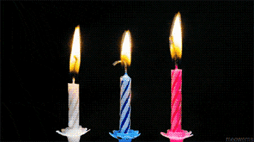 four birthday candles are lit up in a row with the word meowme in the corner