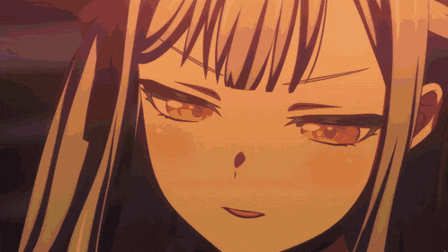 a close up of a girl 's face with a slight smile on her face