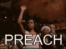 a woman in a pink dress is raising her hand in the air in front of a crowd and the word preach is on the screen