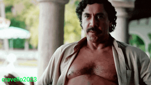 a man without a shirt is standing in front of a sign that says cravello 2023