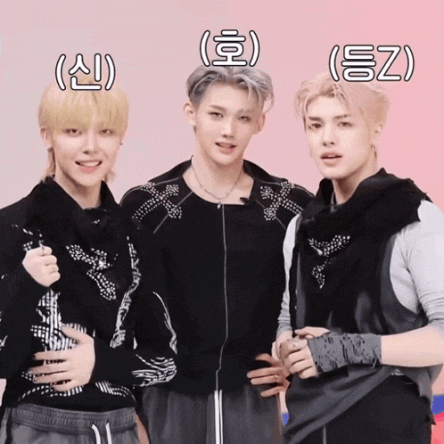 a group of young men are posing for a picture and one of them has the letters ez on his forehead