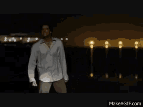 a man in a white shirt is standing in front of a sign that says castigame