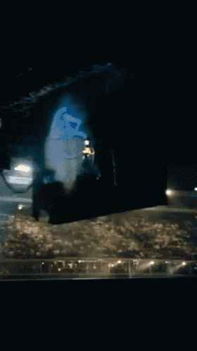 a blue light is shining on a dark surface in a dark room
