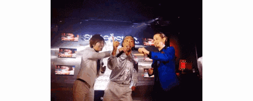 a group of people are dancing in front of a sign that says ' swedish '