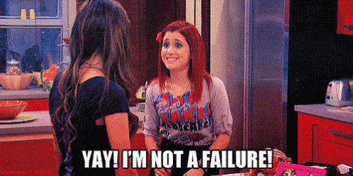 two girls are talking in a kitchen and one of them says yay i 'm not a failure .