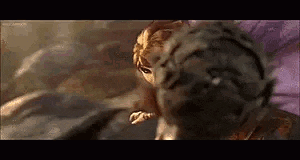 a close up of a cartoon character fighting a tiger .
