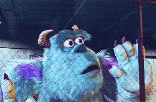 sulley from monsters inc is behind a fence
