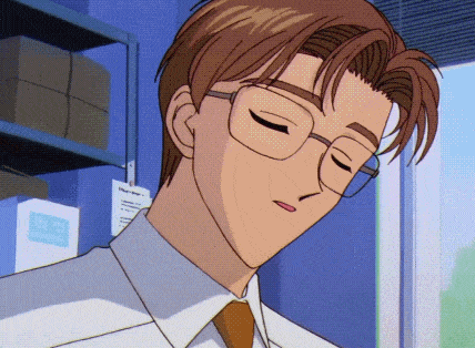 a man wearing glasses and a white shirt is looking down with his eyes closed
