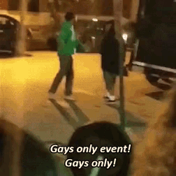 a group of people standing on a sidewalk with the words gays only event