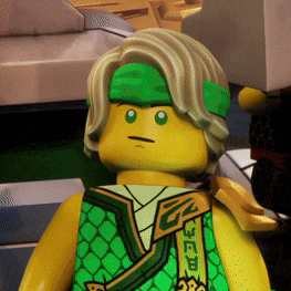 a close up of a lego figure with a green headband on