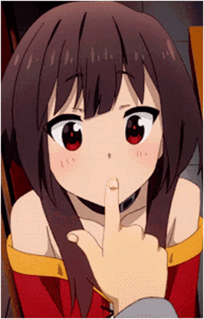 a person is touching a girl 's face with a finger