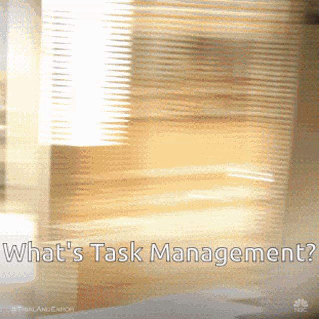 a blurry picture of a room with the words what 's task management