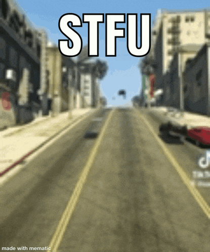 a blurry picture of a city street with the words stfu on the top