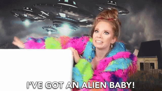 a woman in a colorful fur coat says i ve got an alien baby