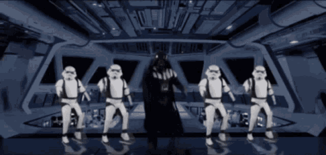 darth vader is surrounded by stormtroopers in a star wars scene