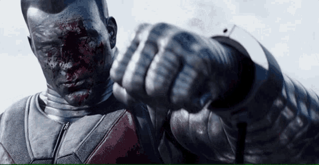 a close up of a man 's fist with blood on it
