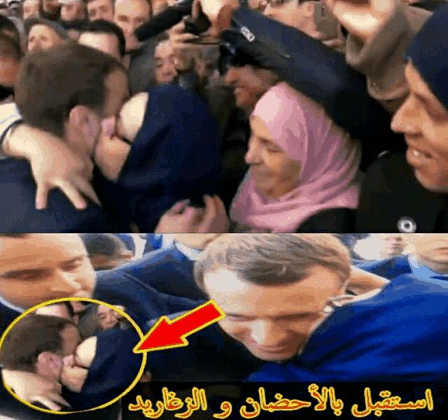 a man in a blue shirt is surrounded by a crowd of people with arabic writing on the bottom
