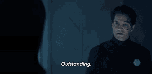 a man in a black uniform says outstanding