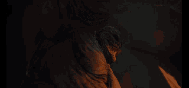 a close up of a statue in the dark