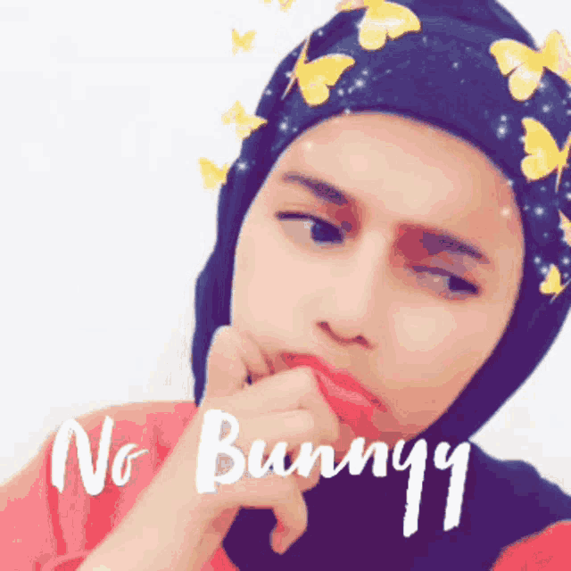 a woman wearing a head scarf with butterflies on it and the words " no bunny " on the bottom