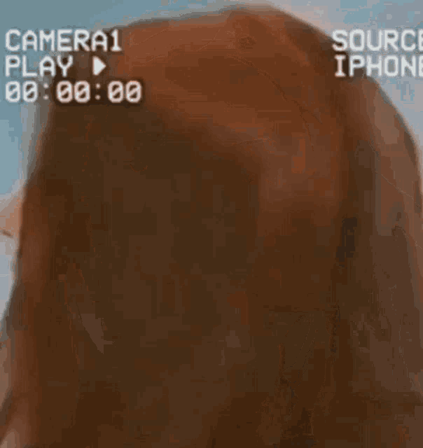 a close up of a woman 's face with the words camera play on the top