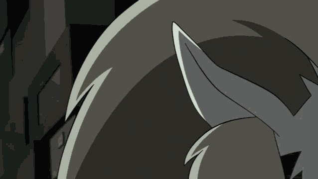 a close up of a cartoon character 's ear with a dark background