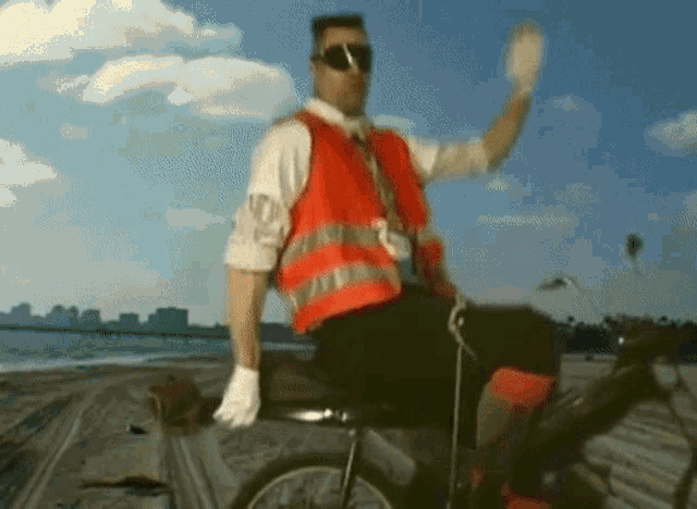 a man wearing a red vest that says no on it