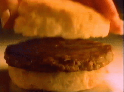 Mcdonalds Sausage Biscuit Breakfast Sandwich GIF - Mcdonalds Sausage Biscuit Breakfast Sandwich Fast Food GIFs