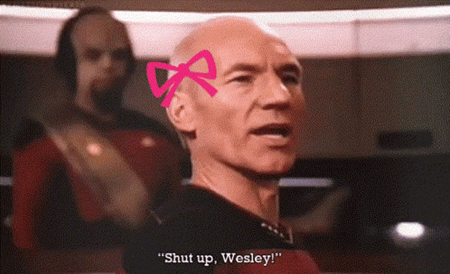 a man with a pink bow on his head is saying " shut up wesley "