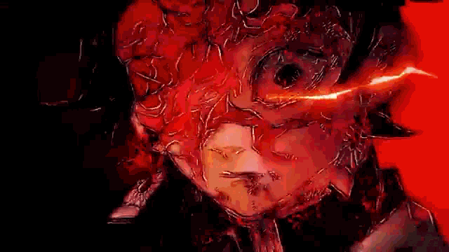 a close up of a person 's face with a red light coming out of it 's eye .
