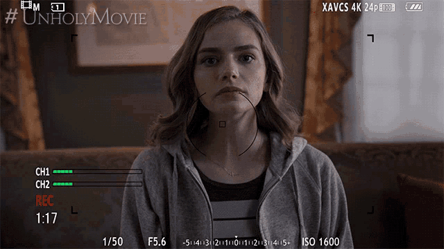 a woman is being recorded on a camera with the hashtag #unholy movie