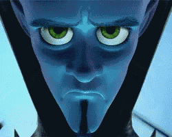 a close up of a cartoon character 's face with a beard and green eyes