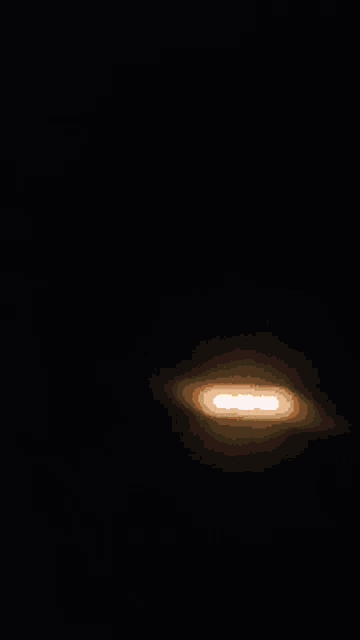 a blurred image of a person 's face and a clock