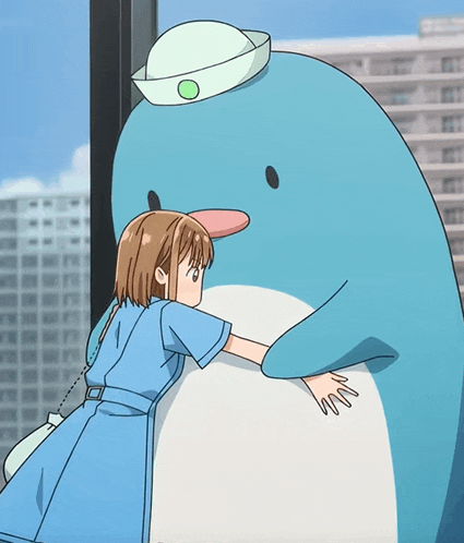a girl in a blue dress is hugging a penguin