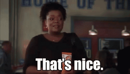 a woman is holding a bag of chips and says `` that 's nice '' .