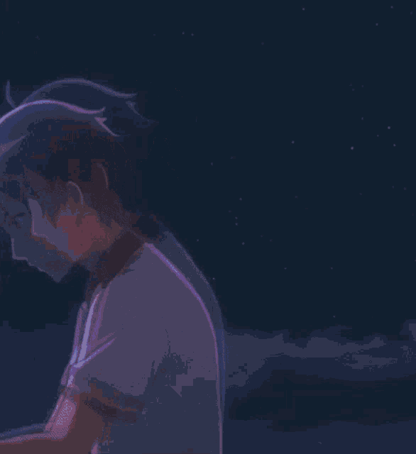 a boy is standing in front of a firework display