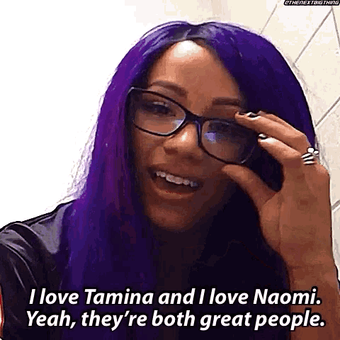 a woman with purple hair and glasses says i love tamina and i love naomi