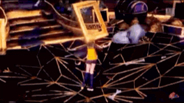 a person holding a picture frame over their head