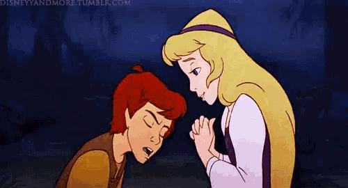 a boy and a girl are holding hands and looking at each other .