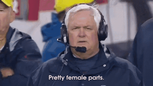 a man wearing headphones says pretty female parts while watching a football game .